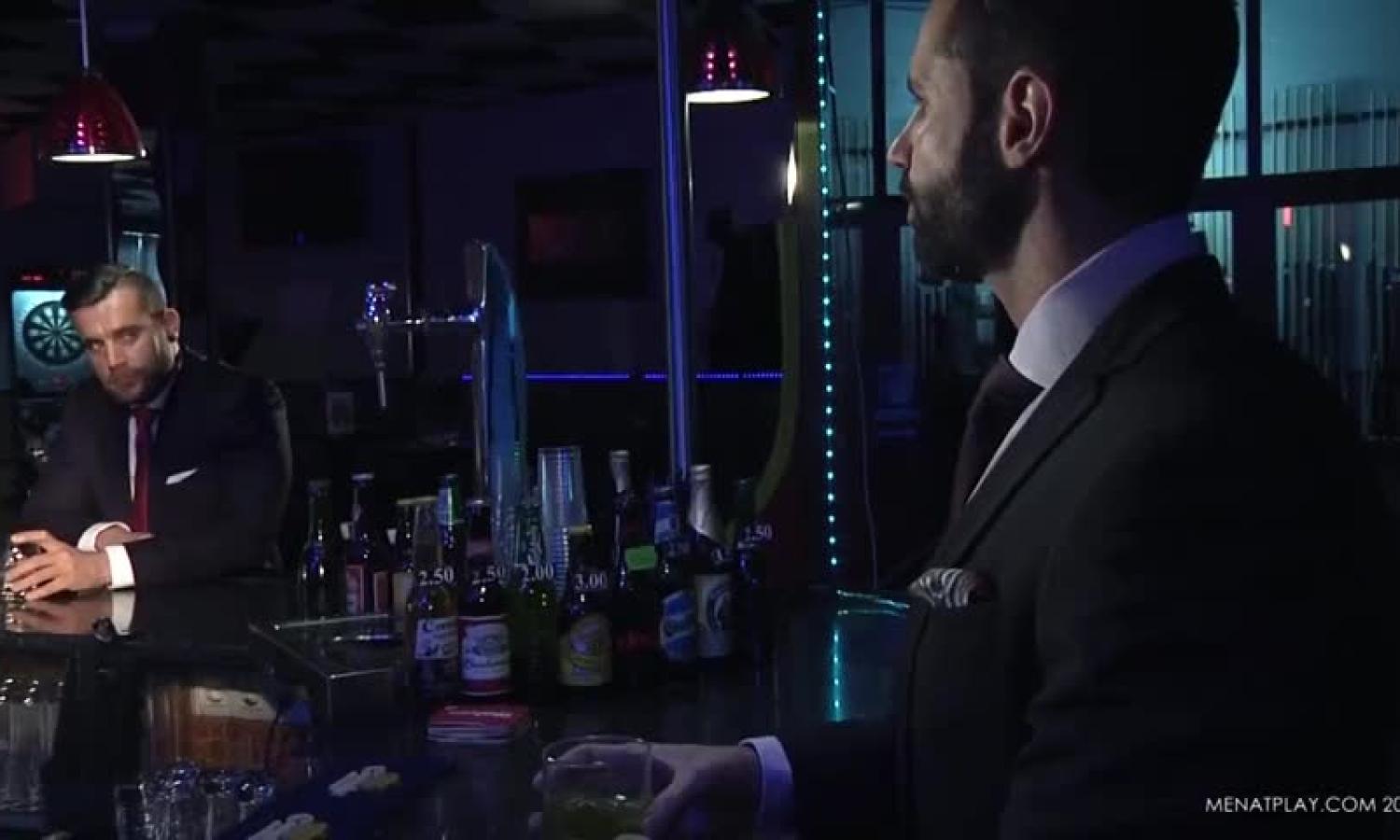 Two guys In Suits Meet In A Bar